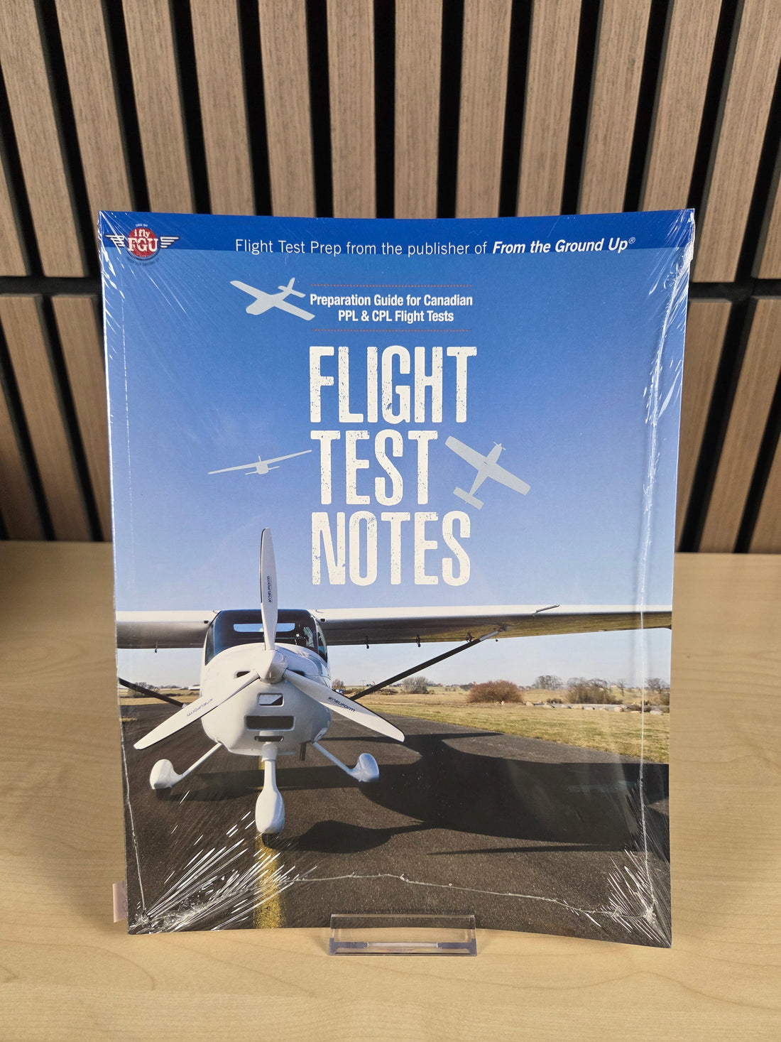 A book named "Flight test notes" sitting on wood surface