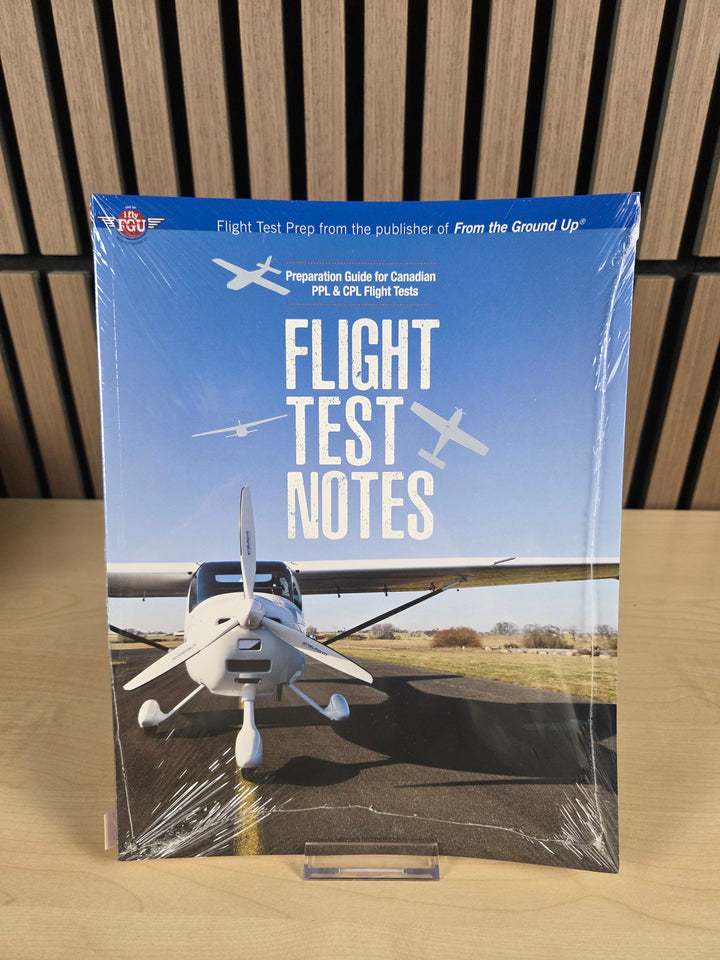 A book named "Flight test notes" sitting on wood surface