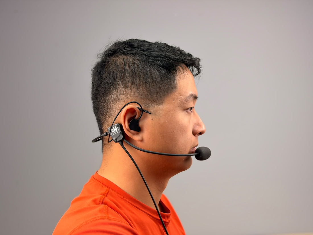 A person wearing UFQ L2 aviation headset