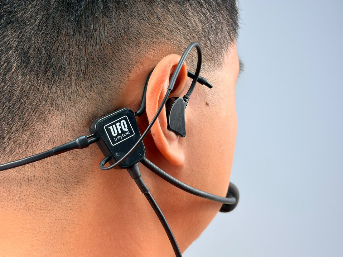 A person wearing UFQ L2 aviation headset, close up shot 