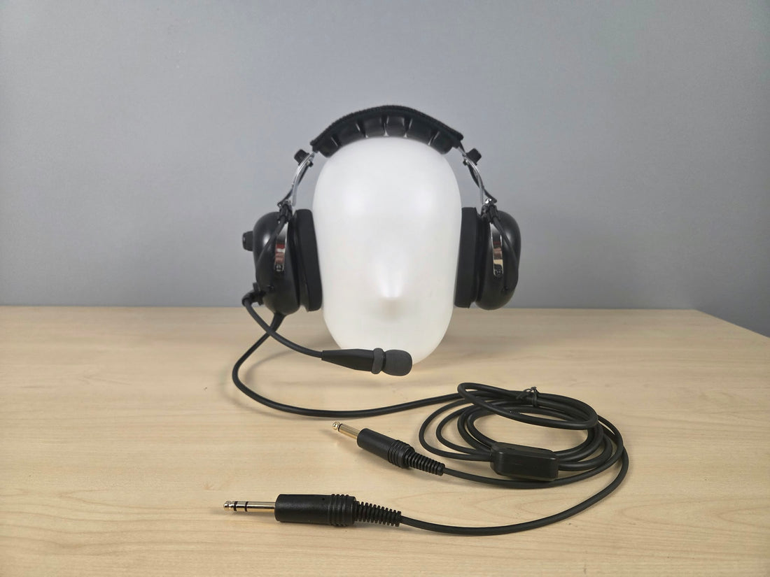 UFQ P1 headset sitting on a wooden desk with gray background